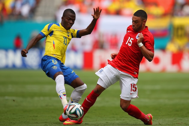 MIAMI GARDENS, FL - JUNE 04: Enner Valencia of Ecuador tackles Alex Oxlade-Chamberlain of England during the International friendly match between England and Ecuador at Sun Life Stadium on June 4, 2014 in Miami Gardens, Florida.  (Photo by Richard Heathcote/Getty Images)