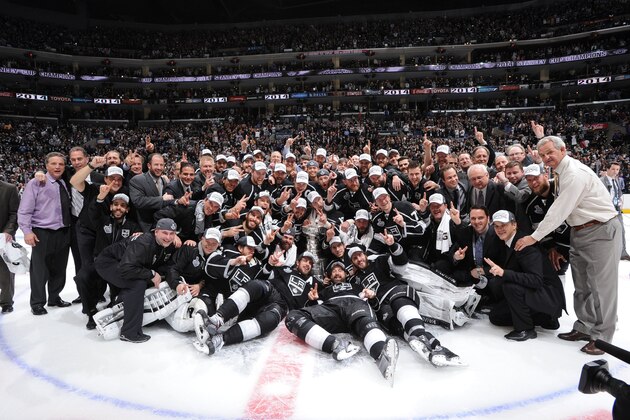 LOS ANGELES, CA - JUNE 13:  The Los Angeles Kings pose for a team photograph after defeating the New York Rangers in the second overtime period of Game Five of the 2014 NHL Stanley Cup Final at Staples Center on June 13, 2014 in Los Angeles, California. (Photo by Andrew D. Bernstein/NHLI via Getty Images)