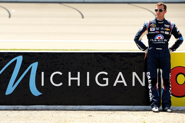 BROOKLYN, MI - JUNE 13:  Kasey Kahne, driver of the #5 Farmers Insurance Chevrolet, looks on from the grid during qualifying for the NASCAR Sprint Cup Series Quicken Loans 400 at Michigan International Speedway on June 13, 2014 in Brooklyn, Michigan.  (Photo by Patrick Smith/Getty Images)