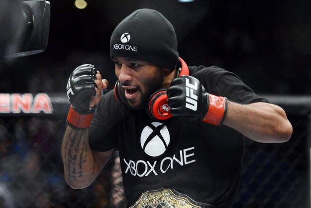 December 14, 2013; Sacramento, CA, USA; Demetrious Johnson celebrates after defeating Joseph Benavidez during the flyweight championship bout of the UFC on FOX 9 at Sleep Train Arena. Mandatory Credit: Kyle Terada-USA TODAY Sports