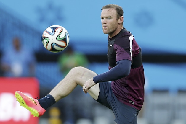 England's Wayne Rooney juggles during a training session at Arena da Amazonia in Manaus, Brazil, Friday, June 13, 2014.  England plays in group D of the 2014 soccer World Cup. (AP Photo/Antonio Calanni)
