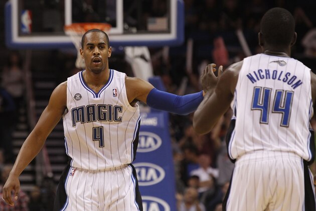 Nov 24, 2013; Orlando, FL, USA; Orlando Magic shooting guard Arron Afflalo (4) high five power forward Andrew Nicholson (44) after making a basket against the Phoenix Suns during the second half at Amway Center. Phoenix Suns 104-96. Mandatory Credit: Kim Klement-USA TODAY Sports