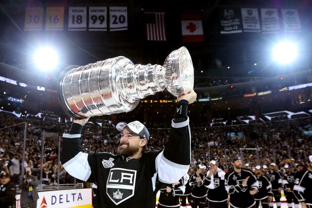 LOS ANGELES, CA - JUNE 13:  Justin Williams #14 of the Los Angeles Kings celebrates with the Stanley Cup after the Kings 3-2 double overtime victory against the New York Rangers in Game Five of the 2014 Stanley Cup Final at Staples Center on June 13, 2014 in Los Angeles, California.  (Photo by Bruce Bennett/Getty Images)