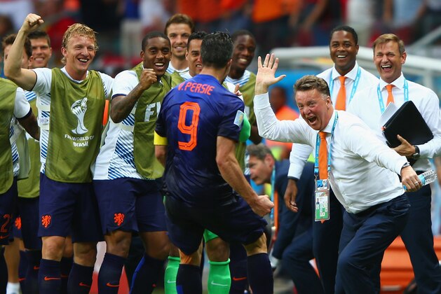 SALVADOR, BRAZIL - JUNE 13: Robin van Persie of the Netherlands (C) celebrates with head coach Louis van Gaal of the Netherlands (R) after scoring the team's first goal in the first half during the 2014 FIFA World Cup Brazil Group B match between Spain and Netherlands at Arena Fonte Nova on June 13, 2014 in Salvador, Brazil. (Photo by Ian Walton/Getty Images) SALVADOR, BRAZIL - JUNE 13: Robin van Persie of the Netherlands (C) celebrates with head coach Louis van Gaal of the Netherlands (R) after scoring the team's first goal in the first half during the 2014 FIFA World Cup Brazil Group B match between Spain and Netherlands at Arena Fonte Nova on June 13, 2014 in Salvador, Brazil. (Photo by Ian Walton/Getty Images)