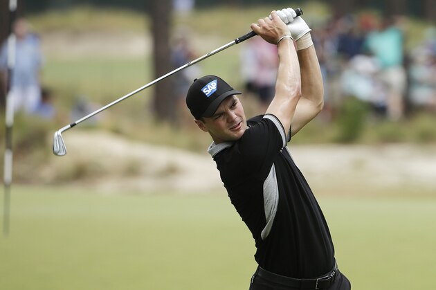 Martin Kaymer, of Germany, watches his tee shot on the seventh hole during the second round of the U.S. Open golf tournament in Pinehurst, N.C., Friday, June 13, 2014. (AP Photo/Chuck Burton)