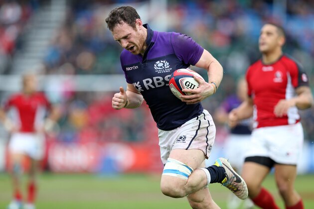 GLASGOW, SCOTLAND - MAY 04:  Scott Riddell of Scotland scores a last minute try against Canada during day two of the IRB Glasgow Sevens at Scotstoun Stadium on May 4, 2014 in Glasgow, Scotland. (Photo by Ian MacNicol/Getty Images)