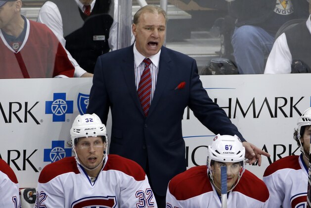 Montreal Canadiens' Michel Therrien, yells at a referee from behind his bench in the third period of an NHL hockey game between the Pittsburgh Penguins and the Montreal Canadiens in Pittsburgh, Wednesday, Jan. 22, 2014. The Penguins won 5-1. (AP Photo/Gene J. Puskar)