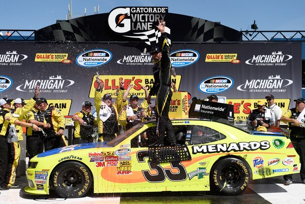 BROOKLYN, MI - JUNE 14:  Paul Menard, driver of the #33 Nibco/Menards Chevrolet, celebrates in Victory Lane after winning the NASCAR Nationwide Series Ollie's Bargain Outlet 250 at Michigan International Speedway on June 14, 2014 in Brooklyn, Michigan.  (Photo by Jason Miller/Getty Images)