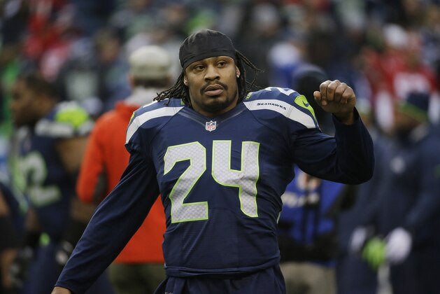 Seattle Seahawks' Marshawn Lynch (24) warms up before the NFL football NFC Championship game against the San Francisco 49ers Sunday, Jan. 19, 2014, in Seattle. (AP Photo/Ted S. Warren)
