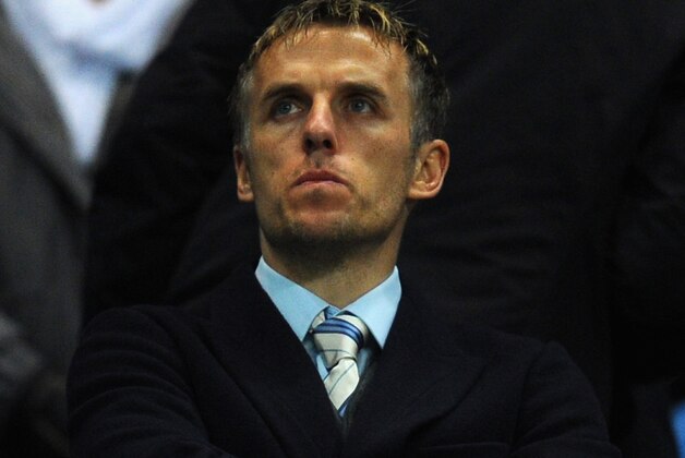 MANCHESTER, ENGLAND - JANUARY 15:  MAnchester United Coach Phil Neville looks on during the Budweiser FA Cup Third Round Replay match between Manchester City and Blackburn Rovers at the Etihad Stadium on January 15, 2014 in Manchester, England.  (Photo by Stu Forster/Getty Images)