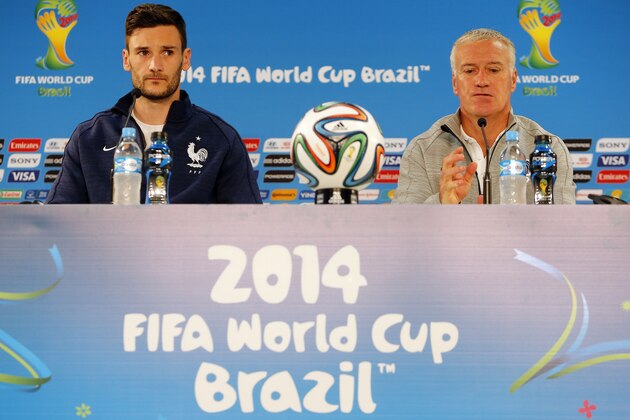 France's soccer team goalkeeper Hugo Lloris, left, and head coach Didier Deschamps, right, attend a press conference before an official training session the day before the group E World Cup soccer match between France and Honduras at the Estadio Beira-Rio in Porto Alegre, Brazil, Saturday, June 14, 2014. (AP Photo/David Vincent)