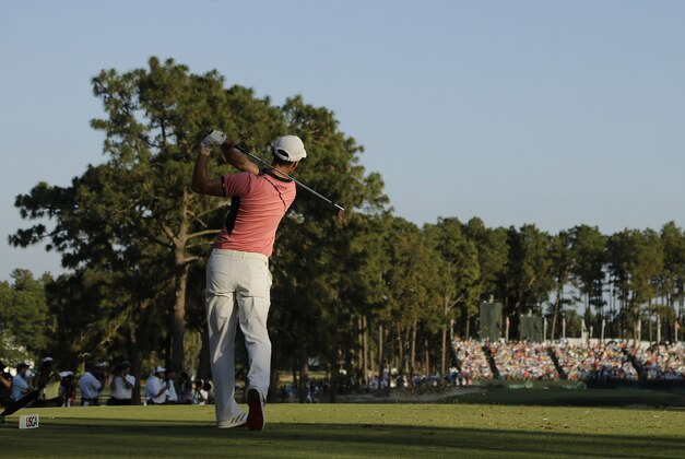 Martin Kaymer, of Germany, watches his tee shot on the 17th hole during the third round of the U.S. Open golf tournament in Pinehurst, N.C., Saturday, June 14, 2014. (AP Photo/Chuck Burton)