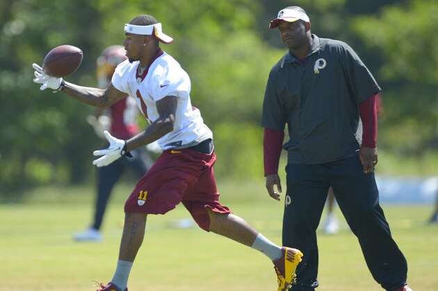 DeSean Jackson catches a pass in front of wide receivers coach Ike Hilliard.