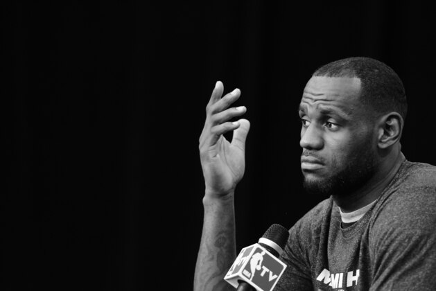 SAN ANTONIO, TX - JUNE 14: ***Shot in Black and White*** LeBron James #6 of the Miami Heat speaks to the media during practice and media availability as part of the 2014 NBA Finals on June 14, 2014 at the Spurs Practice Facility in San Antonio, Texas. NOTE TO USER: User expressly acknowledges and agrees that, by downloading and or using this photograph, User is consenting to the terms and conditions of the Getty Images License Agreement. Mandatory Copyright Notice: Copyright 2014 NBAE (Photo by Garrett W. Ellwood/NBAE via Getty Images)