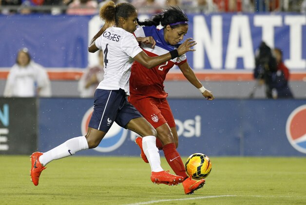TAMPA, FL - JUNE 14:  Forward Sydney Leroux #2 of the United States takes a shot against defender Laura Georges #4 of France to score a goal during the first half of a women's friendly soccer match on June 14, 2014 at Raymond James Stadium in Tampa, Florida.  (Photo by Brian Blanco/Getty Images)