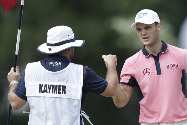 Jun 14, 2014; Pinehurst, NC, USA; Martin Kaymer (right) celebrates with caddie Craig Connolly (left) after a made putt on the 5th green during the third round of the 2014 U.S. Open golf tournament at Pinehurst Resort Country Club - #2 Course. Mandatory Credit: Jason Getz-USA TODAY Sports Jun 14, 2014; Pinehurst, NC, USA; Martin Kaymer (right) celebrates with caddie Craig Connolly (left) after a made putt on the 5th green during the third round of the 2014 U.S. Open golf tournament at Pinehurst Resort Country Club - #2 Course. Mandatory Credit: Jason Getz-USA TODAY Sports