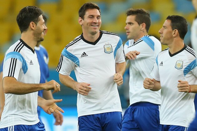 RIO DE JANEIRO, BRAZIL - JUNE 14:  Lionel Messi of Argentina dribbles the ball during a training session at Maracana stadium on June 14, 2014 in Rio de Janeiro, Brazil.  (Photo by Ronald Martinez/Getty Images)