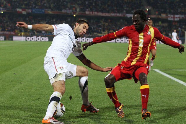 RUSTENBURG, SOUTH AFRICA - JUNE 26: Clint Dempsey of the United States is challenged by Hans Sarpei of Ghana during the 2010 FIFA World Cup South Africa Round of Sixteen match between USA and Ghana at Royal Bafokeng Stadium on June 26, 2010 in Rustenburg, South Africa.  (Photo by Ian Walton/Getty Images)