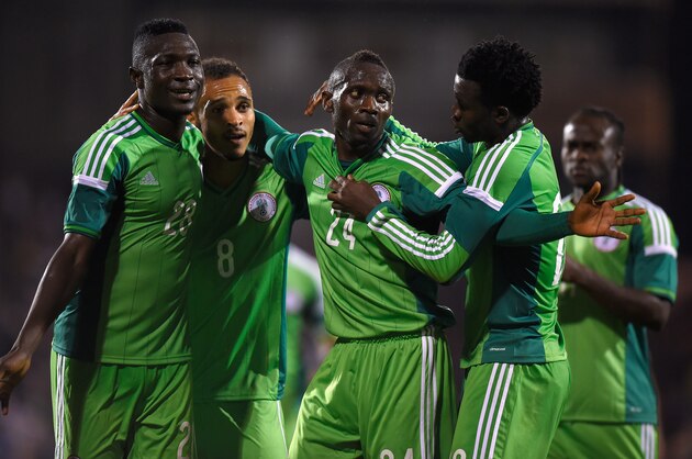 LONDON, ENGLAND - MAY 28:  Uche Nwofor of Nigeria (2nd R) celebrates with team mates after equalising in the last minute during an International Friendly between Scotland and Nigeria at Craven Cottage on May 28, 2014 in London, United Kingdom.  (Photo by Mike Hewitt/Getty Images)