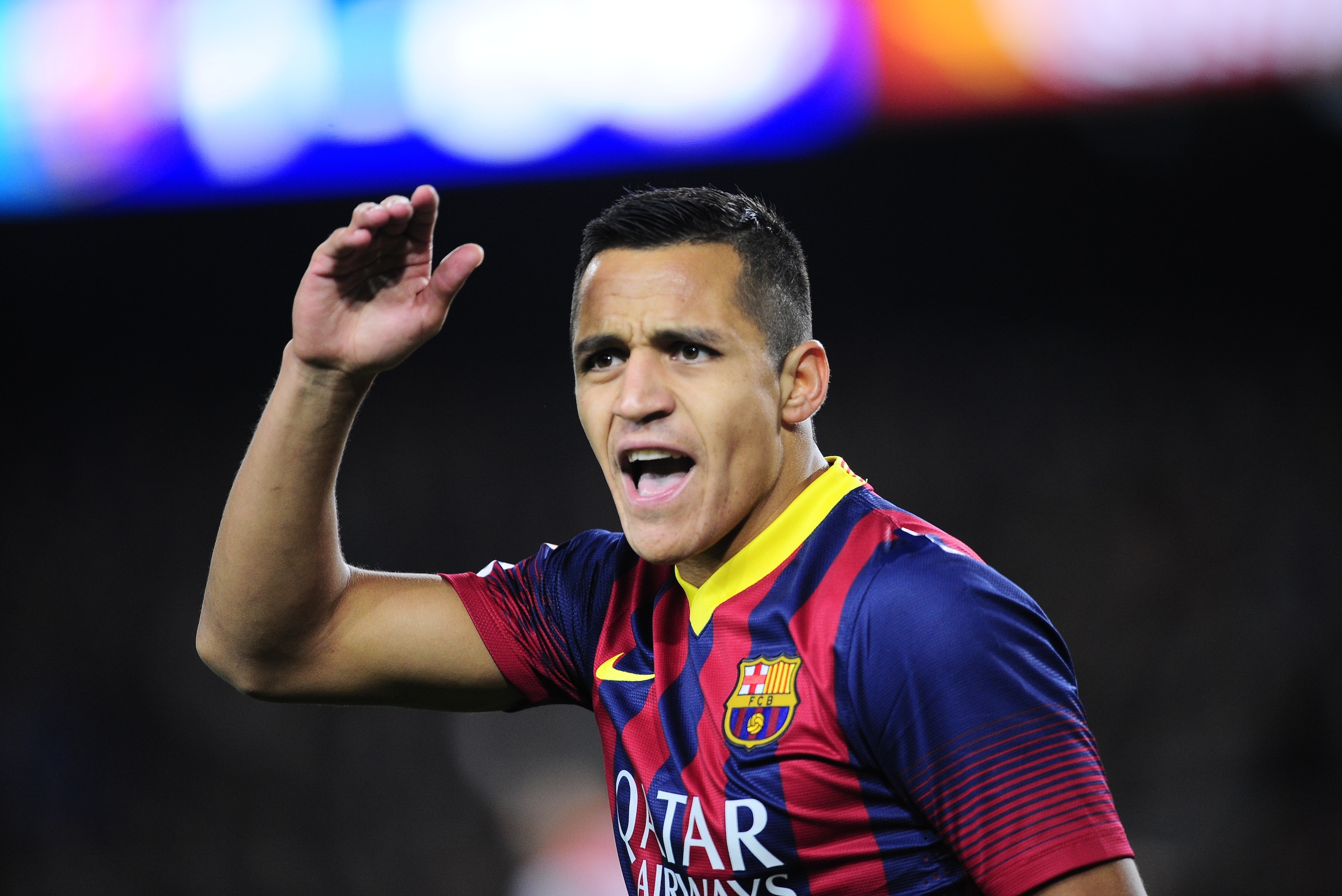 FC Barcelona's Alexis Sanchez, from Chile, reacts against Rayo Vallecano during a Spanish La Liga soccer match at the Camp Nou stadium in Barcelona, Spain, Saturday, Feb. 15, 2014. (AP Photo/Manu Fernandez)