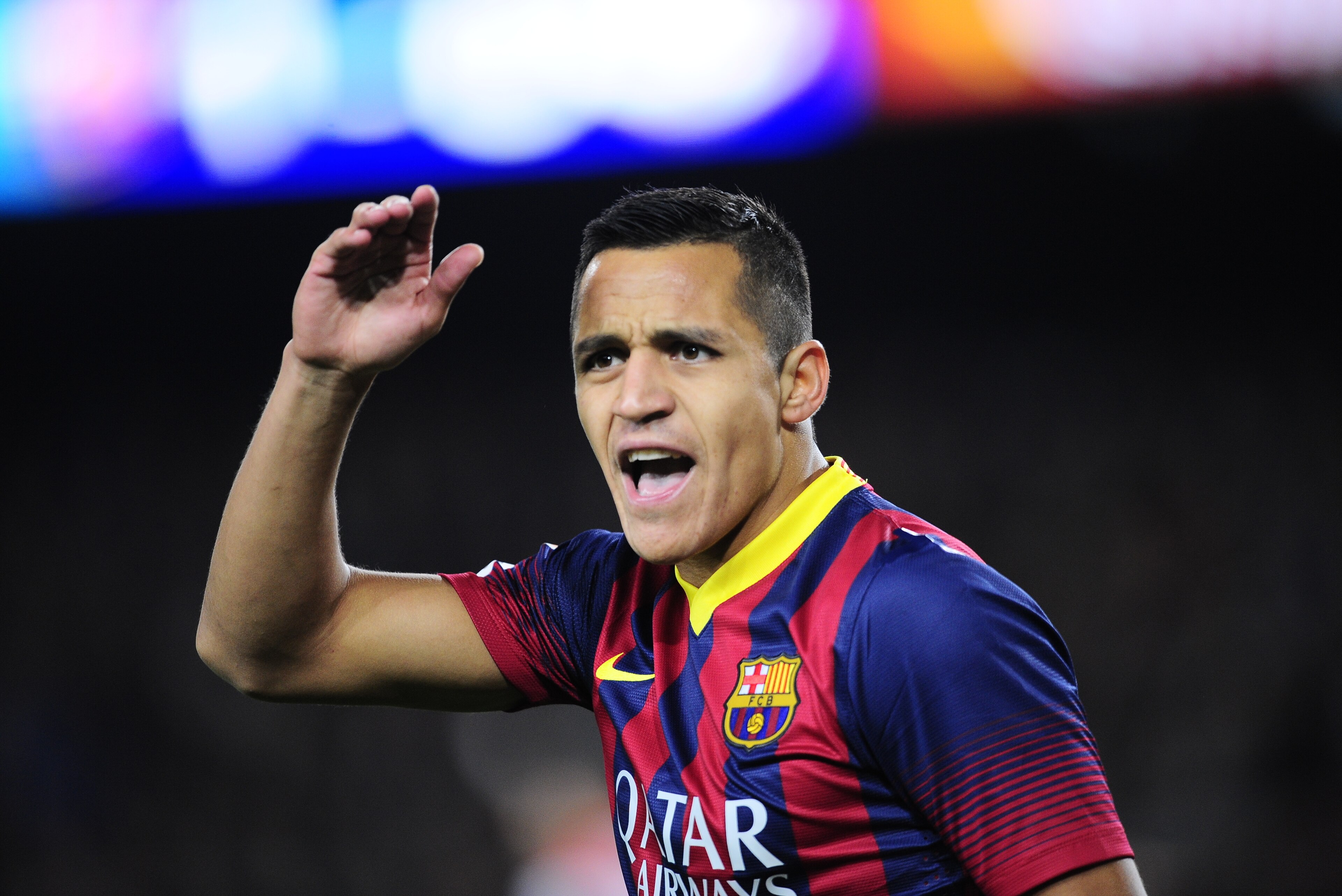 FC Barcelona's Alexis Sanchez, from Chile, reacts against Rayo Vallecano during a Spanish La Liga soccer match at the Camp Nou stadium in Barcelona, Spain, Saturday, Feb. 15, 2014. (AP Photo/Manu Fernandez)