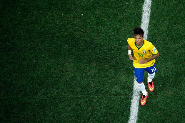 SAO PAULO, BRAZIL - JUNE 12: Neymar of Brazil runs off the field during the 2014 FIFA World Cup Brazil Group A match between Brazil and Croatia at Arena de Sao Paulo on June 12, 2014 in Sao Paulo, Brazil.  (Photo by Fabrizio Bensch - Pool/Getty Images)