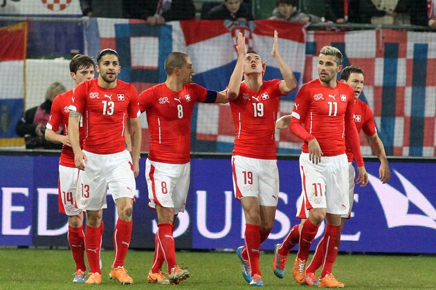 ST GALLEN, SWITZERLAND - MARCH 05: (L-R) Ricardo Rodriguez, Goekhan Inler, Josip Drmic and Valon Behrami of Switzerland celebrate the first goal of the match during the international friendly match between Switzerland and Croatia at the AFG Arena on March 5, 2014 in St Gallen, Switzerland.  (Photo by Marc Eich/Getty Images)
