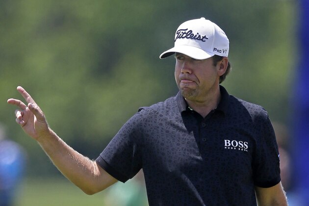 Erik Compton reacts after a birdie on the ninth hole during the opening round of the Zurich Classic golf tournament at TPC Louisiana in Avondale, La., Thursday, April 24, 2014. (AP Photo/Gerald Herbert)