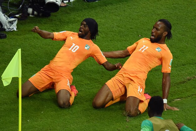 RECIFE, BRAZIL - JUNE 14:  Gervinho of the Ivory Coast (L) celebrates scoring his team's second goal with teammate Didier Drogba during the 2014 FIFA World Cup Brazil Group C match  between the Ivory Coast and Japan at Arena Pernambuco on June 14, 2014 in Recife, Brazil.  (Photo by Matthias Hangst/Getty Images)
