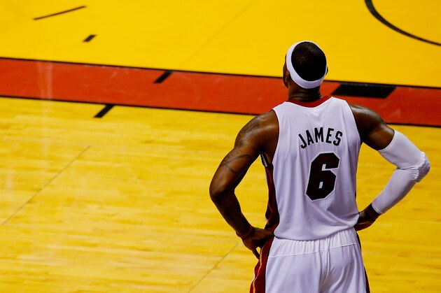 MIAMI, FL - JUNE 12:  LeBron James #6 of the Miami Heat looks on against the San Antonio Spurs during Game Four of the 2014 NBA Finals at American Airlines Arena on June 12, 2014 in Miami, Florida. NOTE TO USER: User expressly acknowledges and agrees that, by downloading and or using this photograph, User is consenting to the terms and conditions of the Getty Images License Agreement.  (Photo by Chris Trotman/Getty Images)
