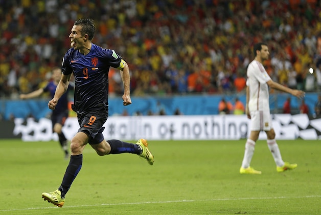 Netherlands' Robin van Persie celebrates after his scoring his side's fourth goal during the second half of the group B World Cup soccer match between Spain and the Netherlands at the Arena Ponte Nova in Salvador, Brazil, Friday, June 13, 2014.  (AP Photo/Natacha Pisarenko)