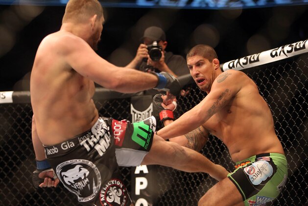 Sep 21, 2013; Toronto, Ontario, CAN; Matt Mitrione (left) kicks Brendan Schaub during their Heavyweight bout at UFC 165 at the Air Canada Centre. Mandatory Credit: Tom Szczerbowski-USA TODAY Sports