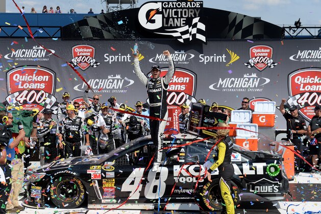 BROOKLYN, MI - JUNE 15:  Jimmie Johnson, driver of the #48 Lowe's/Kobalt Tools Chevrolet, celebrates in Victory Lane after winning the NASCAR Sprint Cup Series Quicken Loans 400 at Michigan International Speedway on June 15, 2014 in Brooklyn, Michigan.  (Photo by Jason Miller/Getty Images)