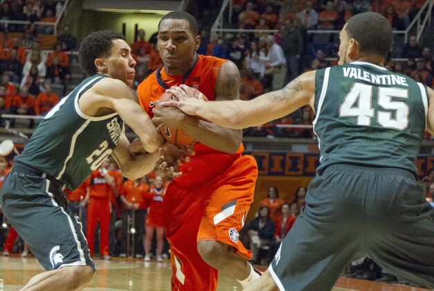 Jan 18, 2014; Champaign, IL, USA; Michigan State Spartans guard Travis Trice (20) and guard Denzel Valentine (45) tie up the ball with Illinois Fighting Illini guard Tracy Abrams (13) in the first half of the game at State Farm Center. The Michigan State Spartans beat the Illinois Fighting Illini 78-62. Mandatory Credit: Trevor Ruszkowski-USA TODAY Sports