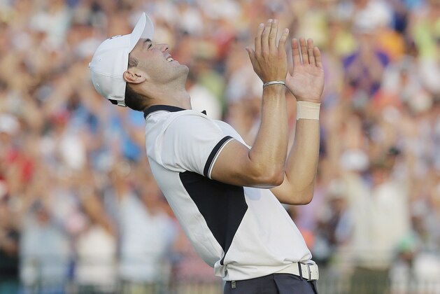 Martin Kaymer, of Germany celebrates after winning the U.S. Open golf tournament in Pinehurst, N.C., Sunday, June 15, 2014.  (AP Photo/Eric Gay)