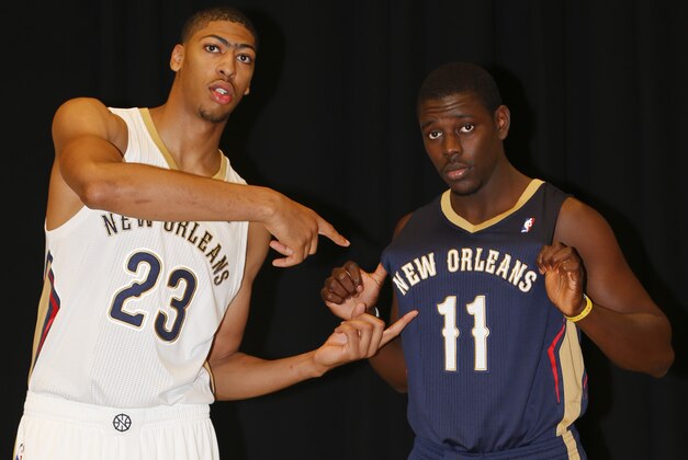 Aug 1, 2013; Metairie, LA, USA; New Orleans Pelicans forward Anthony Davis (23) with guard Jrue Holiday (11) during a uniform unveiling at the team practice facility. Mandatory Credit: Derick E. Hingle-USA TODAY Sports