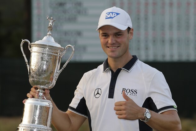 Martin Kaymer, of Germany, poses with the trophy after wining the U.S. Open golf tournament in Pinehurst, N.C., Sunday, June 15, 2014.  (AP Photo/Eric Gay)