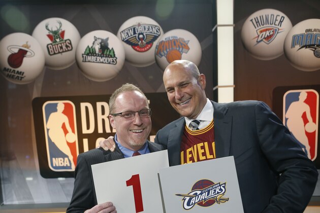 Cleveland Cavaliers general manager David Griffin, left, and minority owner Jeff Cohen celebrate after the Cavaliers won the top pick in the the NBA basketball draft lottery in New York, Tuesday, May 20, 2014. It's the third time in four years the Cavs will be atop the draft after moving up from the ninth spot. (AP Photo/Kathy Willens)