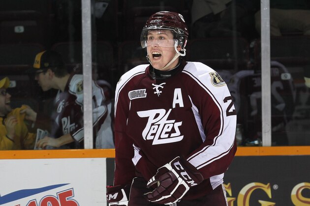 PETERBOROUGH, ON - FEBRUARY 20:  Nick Ritchie #20 of the Peterborough Petes celebrates his empty net goal against the Saginaw Spirit during an OHL game at the Memorial Centre on February 20, 2014 in Peterborough, Ontario, Canada. The Petes defeated the Spirit 5-2. (Photo by Claus Andersen/Getty Images)