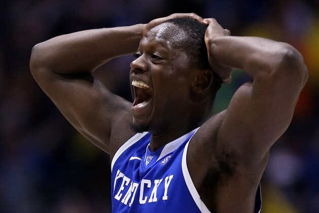 INDIANAPOLIS, IN - MARCH 30:  Julius Randle #30 of the Kentucky Wildcats celebrates after defeating the Michigan Wolverines 75 to 72 in the midwest regional final of the 2014 NCAA Men's Basketball Tournament at Lucas Oil Stadium on March 30, 2014 in Indianapolis, Indiana.  (Photo by Jonathan Daniel/Getty Images)