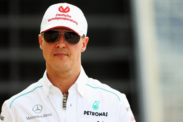 SAO PAULO, BRAZIL - NOVEMBER 23:  Michael Schumacher of Germany and Mercedes GP walks in the paddock following practice for the Brazilian Formula One Grand Prix at the Autodromo Jose Carlos Pace on November 23, 2012 in Sao Paulo, Brazil.  (Photo by Mark Thompson/Getty Images)