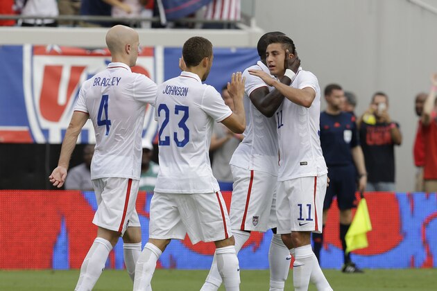 JACKSONVILLE, FL - JUNE 07:  Midfielder Alejandro Bedoya #11 of the United States is hugged by forward Jozy Altidore #17 while midfielder Michael Bradley #4 and defender Fabian Johnson #23 look on after Altidore's goal during the international friendly match against Nigeria at EverBank Field on June 7, 2014 in Jacksonville, Florida.  (Photo by Mike Zarrilli/Getty Images)