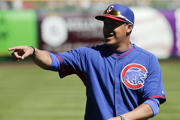 Chicago Cubs shortstop Javier Baez warms up before a spring exhibition baseball game against the San Francisco Giants in Scottsdale, Ariz., Monday, March 10, 2014. (AP Photo/Chris Carlson)