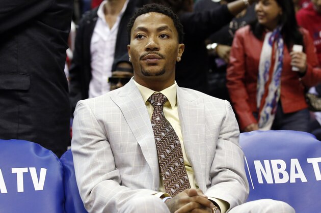 Chicago Bulls guard Derrick Rose (1) sits on the bench in the first half of Game 3 of an opening-round NBA basketball playoff series against the Washington Wizards, Friday, April 25, 2014, in Washington. (AP Photo/Alex Brandon)