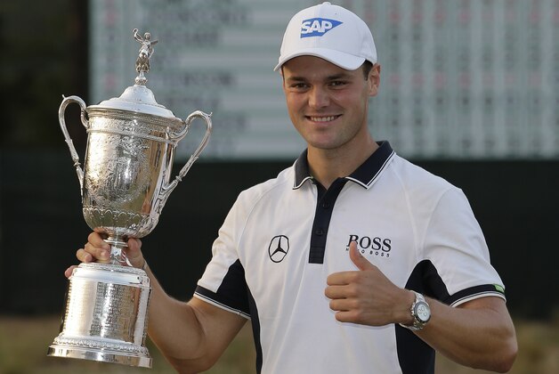 Martin Kaymer, of Germany, poses with the trophy after wining the U.S. Open golf tournament in Pinehurst, N.C., Sunday, June 15, 2014.  (AP Photo/Eric Gay)