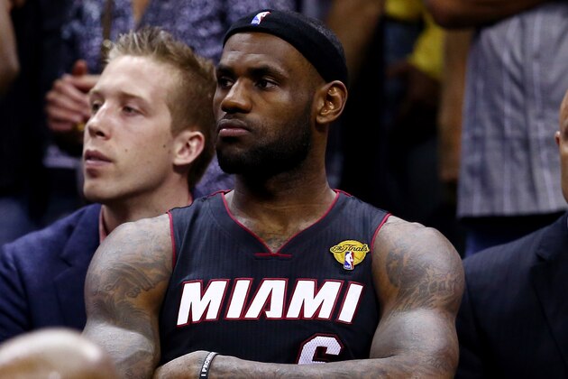 SAN ANTONIO, TX - JUNE 15: LeBron James #6 of the Miami Heat looks on from the bench in the closing minutes of Game Five of the 2014 NBA Finals against the San Antonio Spurs at the AT&T Center on June 15, 2014 in San Antonio, Texas. NOTE TO USER: User expressly acknowledges and agrees that, by downloading and or using this photograph, User is consenting to the terms and conditions of the Getty Images License Agreement.  (Photo by Andy Lyons/Getty Images)