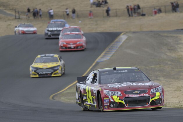 Jun 23, 2013; Sonoma, CA, USA; NASCAR Sprint Cup Series driver Jeff Gordon (24) races through turn eight during the Toyota/Save Mart 350 at Sonoma Raceway. Mandatory Credit: Ed Szczepanski-USA TODAY Sports