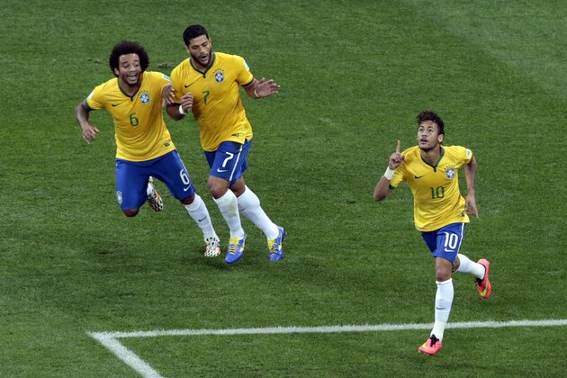 Brazil's Neymar, right, celebrates scoring his side's first goal during the group A World Cup soccer match between Brazil and Croatia, the opening game of the tournament, in the Itaquerao Stadium in Sao Paulo, Brazil, Thursday, June 12, 2014.  (AP Photo/Shuji Kajiyama)