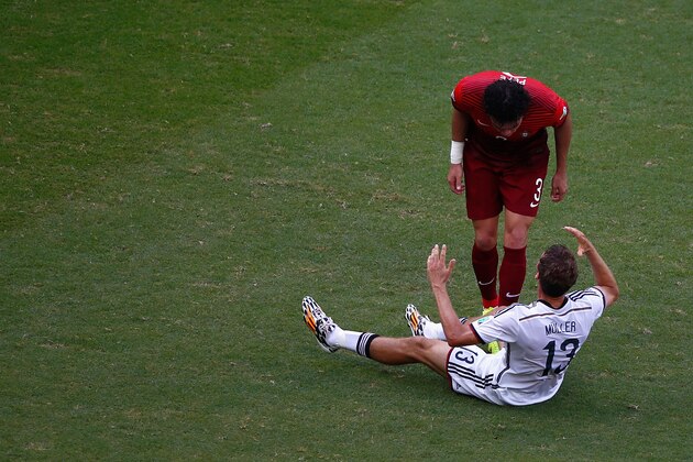 SALVADOR, BRAZIL - JUNE 16:  Thomas Mueller of Germany reacts after a headbutt by Pepe of Portugal resulting in a red card for Pepe during the 2014 FIFA World Cup Brazil Group G match between Germany and Portugal at Arena Fonte Nova on June 16, 2014 in Salvador, Brazil.  (Photo by Matthew Lewis/Getty Images)