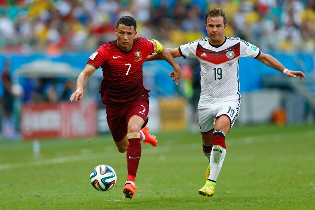 SALVADOR, BRAZIL - JUNE 16:  Cristiano Ronaldo of Portugal controls the ball against Mario Goetze of Germany during the 2014 FIFA World Cup Brazil Group G match between Germany and Portugal at Arena Fonte Nova on June 16, 2014 in Salvador, Brazil.  (Photo by Phil Walter/Getty Images)
